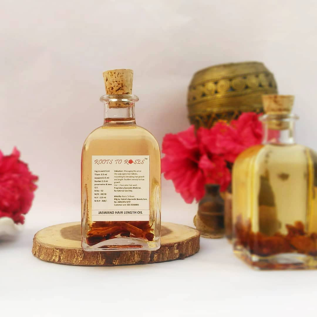 Jaswand hibiscus hair growth oil with visible flowers