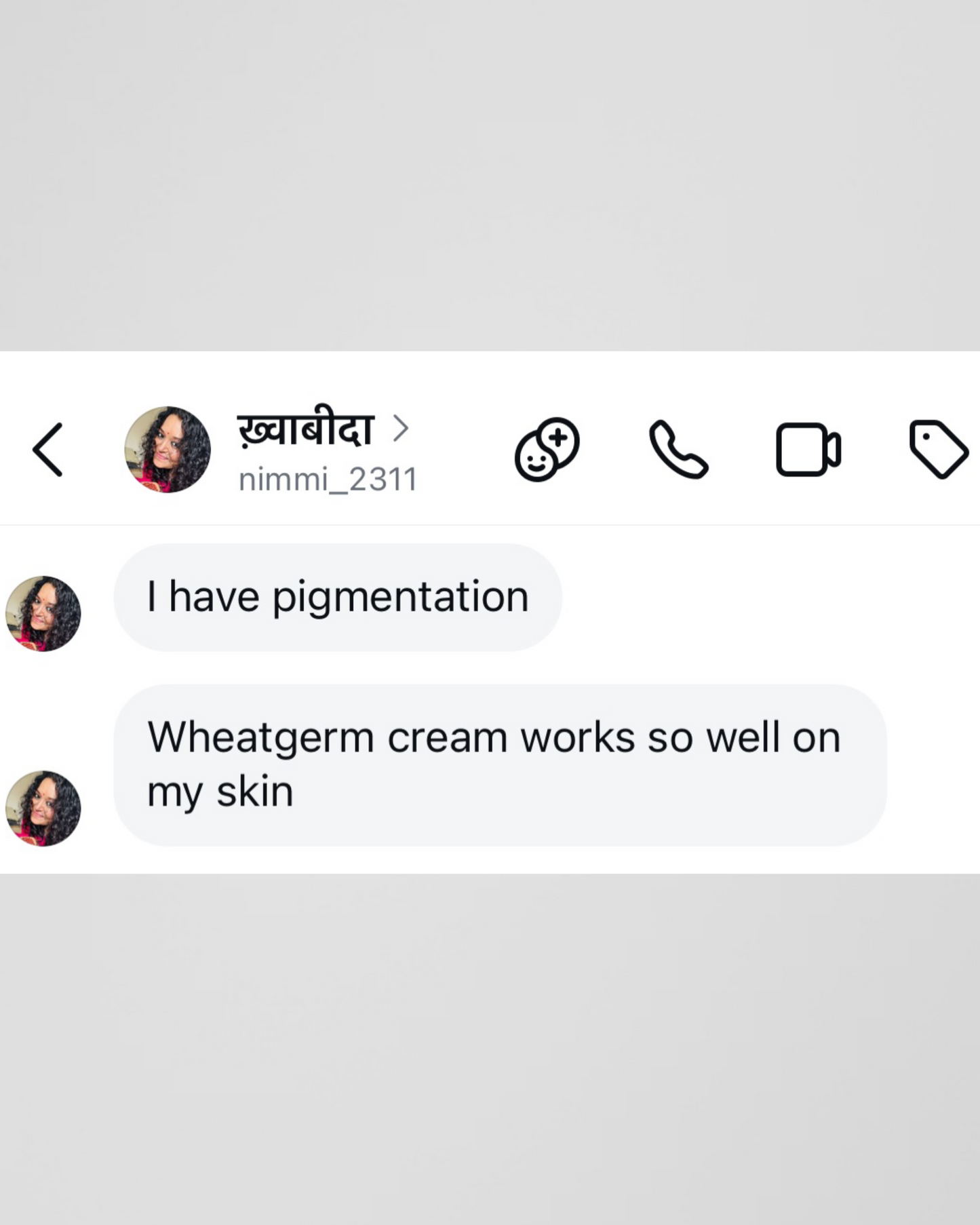 Text conversation about pigmentation and wheatgerm cream on a gray background